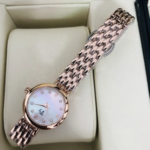 Elegant rose gold women's watch with mother-of-pearl dial and crystals in a gift box