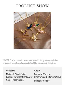 Close-up of ballet girl pendants with colorful zircons on silk background
