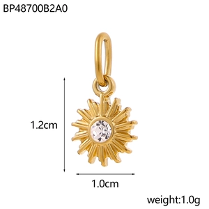 Golden sunburst pendant in stainless steel with crystal center, measuring 1.2cm by 1.0cm