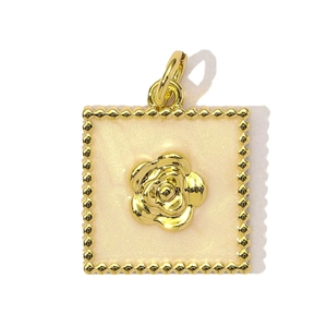 Detail view of a square gold pendant featuring a cream enamel camellia flower with zircon
