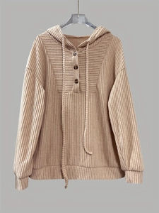 Detail of ribbed knit texture on a khaki long sleeve hooded sweatshirt with buttons