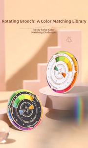 Rotating enamel color wheel brooch featuring triadic and analogous design guides