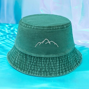 Unisex dark green washed cotton bucket hat featuring minimalist white mountain embroidery