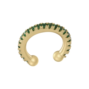 Macro view of gold ear cuff with green zircons and spherical ends on white background