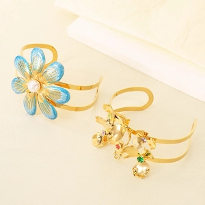 Exaggerated double-layered gold flower open bangle with colorful gems and blue enamel