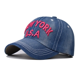 Detail of vintage blue denim baseball cap with pink New York USA 3D embroidery and stitching