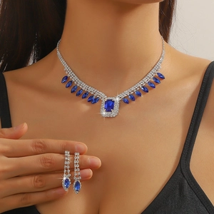 Elegant blue crystal jewelry set featuring rectangular stones and diamond accents