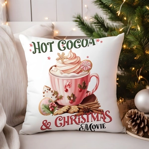 Detail of Christmas pillow cover with Hot Cocoa print and festive holiday decorations