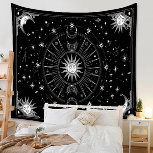 Bohemian sun and moon celestial tapestry hanging above a bedroom bed for cozy wall decor