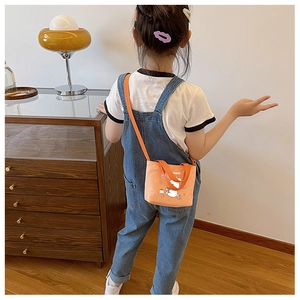 Rear view of child wearing orange canvas shoulder bag with cartoon animal print