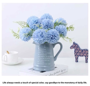 Blue artificial chrysanthemum bouquet in a ceramic vase for home and wedding decor