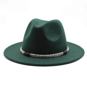 Detailed macro view of dark green wool fedora with a tricolor braided rope band