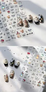 Holographic nail stickers M-918 featuring cute cartoon dogs, bows and flower patterns