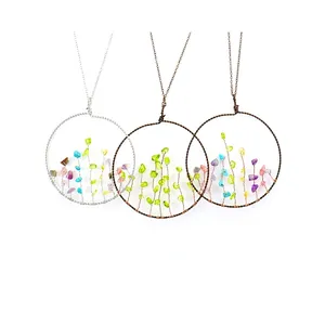 Three handmade life tree wire wrapped necklaces with colorful natural crystal stones