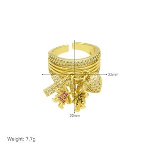 Detail showing dimensions of a gold multi-row ring with heart and cross charms