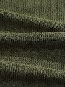 Detailed macro view of army green corduroy fabric showing rich texture and soft ridges