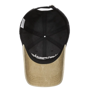 Inside view of a vintage cotton baseball cap showing the embroidery and adjustable metal buckle
