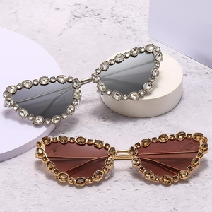 Luxury rhinestone cat-eye sunglasses with sparkly crystals and metallic frame for parties