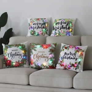 Christmas LED decorative throw pillows with festive wreaths and glowing colored lights
