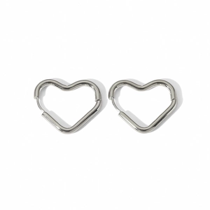 Detailed close-up of heart-shaped earrings in polished silver stainless steel