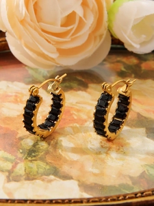 Detail of 18K gold stainless steel hoop earrings with black square zircon inlays