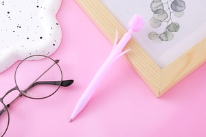 Close-up of pink tulip-shaped mechanical pencil on a matching pink background