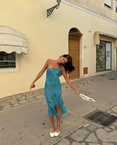 Blue snake print one-shoulder chiffon maxi dress with high slit in outdoor resort setting