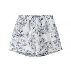 Short d'été blanc à imprimé fleuri pour femme avec taille élastique et ourlet replié