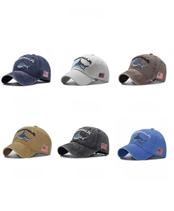 Color display of six washed cotton baseball caps with shark embroidery and US flags