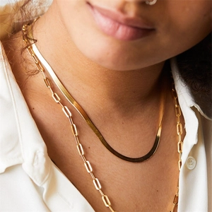 Chic layered necklace set featuring a snake chain and paperclip link in gold finish