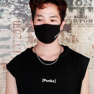 Black face mask with white ONR logo on a model standing against a graffiti wall background