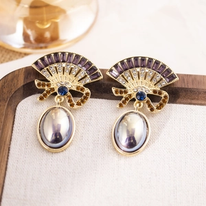 Vintage gold earrings with purple gemstone fan design and large oval pearl drops