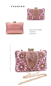 Macro detail of pink rhinestone feather patterns on evening clutch with golden chain
