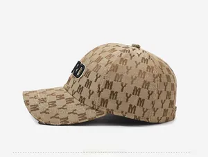 Side view of khaki baseball cap featuring MY jacquard pattern and RD 3D embroidery