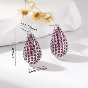 Detailed view of silver teardrop earrings with purple zircon and dimension measurements