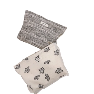 Minimalist cotton linen handbags featuring textured grey fabric and floral butterfly patterns