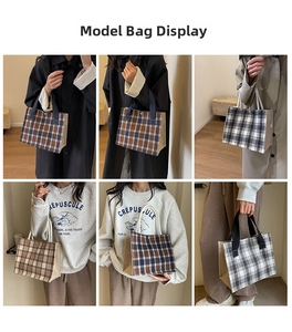 Detail view of British plaid lunch tote bag showing mixed patterns and model styling