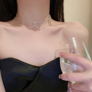Minimalist double-layer chain necklace with small beads and rhinestones on model