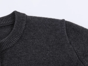 Detail shot of the ribbed round neckline on this charcoal grey horse embroidery cardigan
