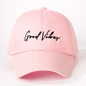 Pink cotton baseball cap with black Good Vibes embroidery on a clean white background