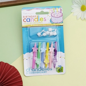 Set of 6 colorful flower-shaped birthday candles with white holders made of natural wax