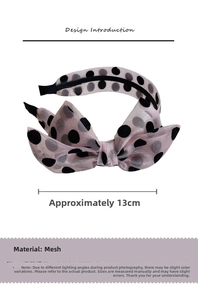 Close-up of pink polka dot mesh bow headband with layered fabric and 13cm width detail