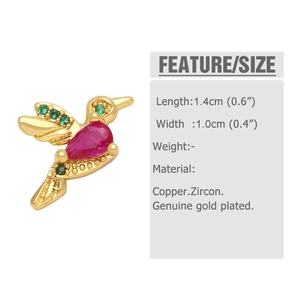 Detailed close-up of hummingbird earring with red pear-cut and green pavé zircons