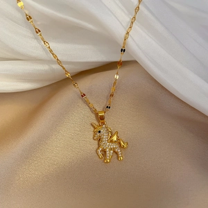 Detailed view of a gold-plated unicorn pendant with sparkling rhinestones on silk