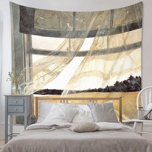 Detail view of Bohemian bedroom tapestry featuring landscape art print on a neutral wall