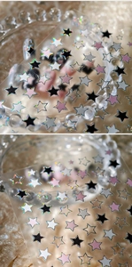 Macro detail of star nail stickers in black, white and holographic glitter on glass