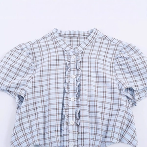 Short sleeve plaid dress in light blue and coffee with ruffle details and buttons