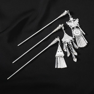 Detailed set of silver Miao hairpins featuring butterfly tassels and ethnic patterns