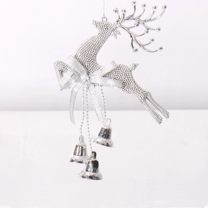 Detailed view of silver reindeer ornament with bells for Christmas tree decoration