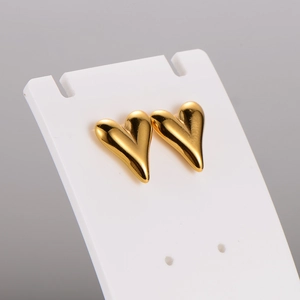 Minimalist gold stainless steel heart stud earrings on white card display